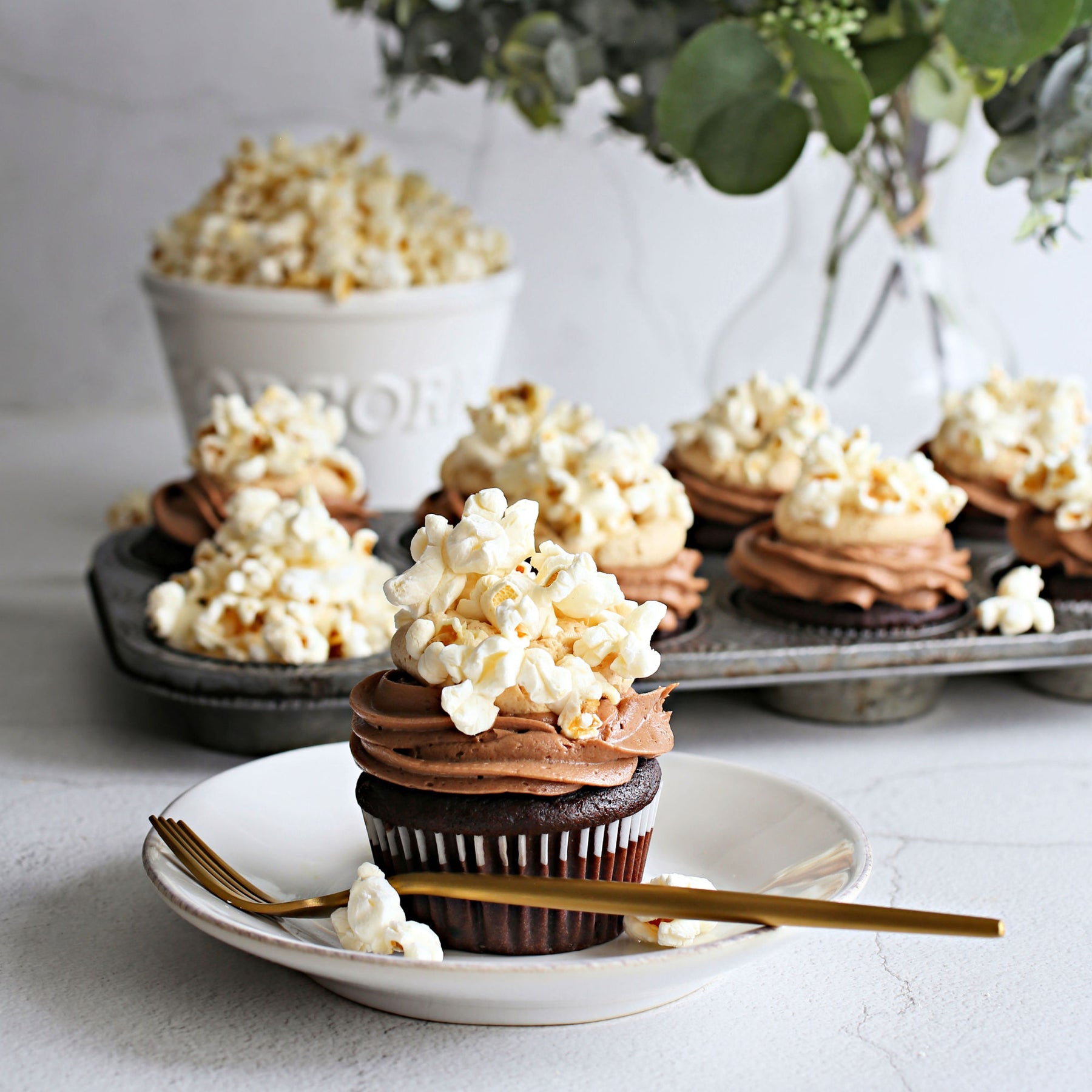 Popcorn Topped Chocolate and Peanut Butter Cupcakes