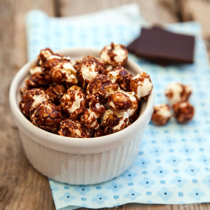 Crunchy homemade chocolate caramel popcorn made with Dell Cove® Extra Large Mushroom popcorn kernels and a rich, buttery chocolate-infused caramel coating. 