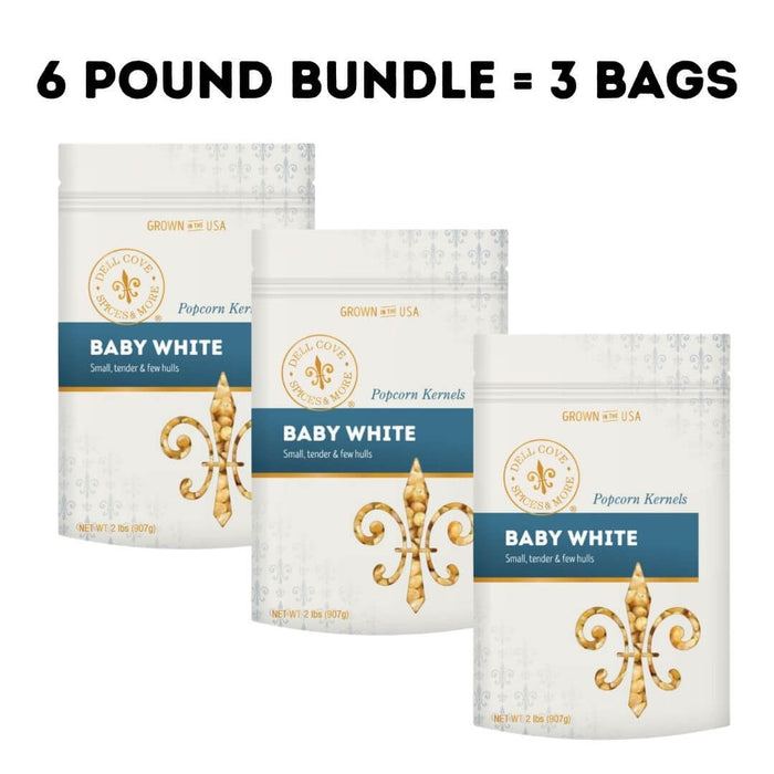 Bulk bundle of 6 pounds of Baby White gourmet popcorn kernels from Dell Cove Spices & More in three 2 pound bags.