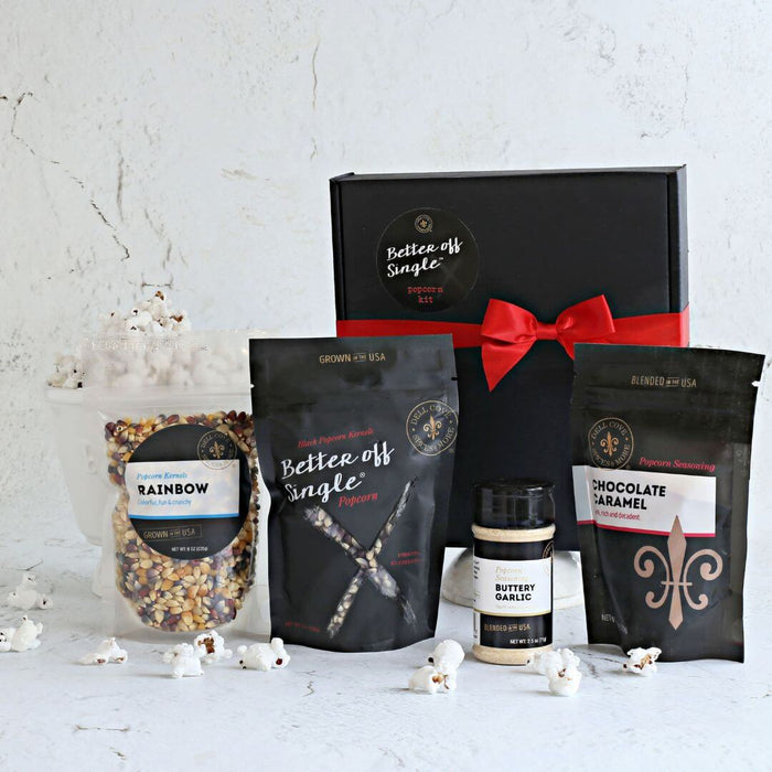 Open Better Off Single® Build Your Own Popcorn Gift Box showing two popcorn bags and two seasonings for movie nights and self care