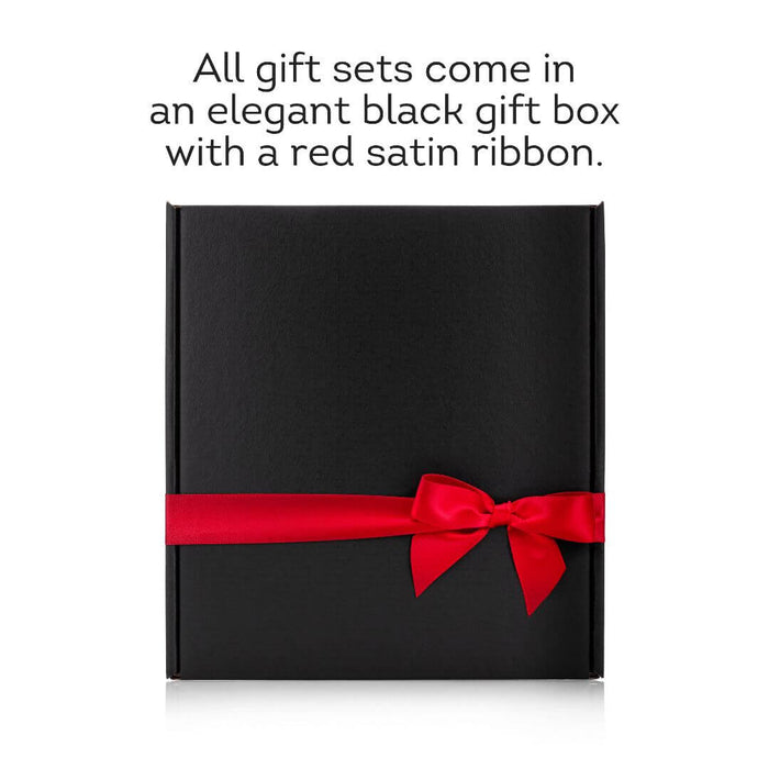 Black gift box with a red satin ribbon on a white background