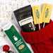 Salted Butter lollipops with Dell Cove popcorn and Buttery Garlic seasoning in a red Christmas stocking