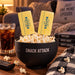 Salted Butter Sweet Cream and Honey Butter lollipops tucked into a Snack Attack bowl of popcorn for movie night