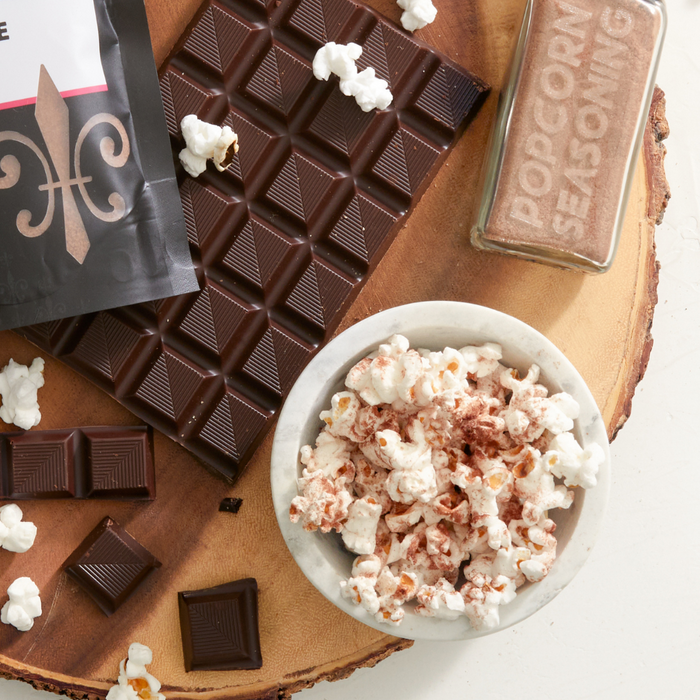 Chocolate Caramel Popcorn Seasoning on popcorn with chocolate bar - dell cove spices