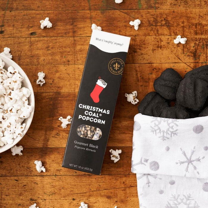 Dell Cove® Christmas Coal black popcorn kernels in holiday gift packaging and lumps of coal