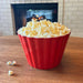 Crate & Barrel red melamine popcorn tub filled with popcorn