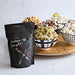 Self-care gift for women — Better Off Single® Popcorn Kit with popped popcorn and cozy movie night setup.