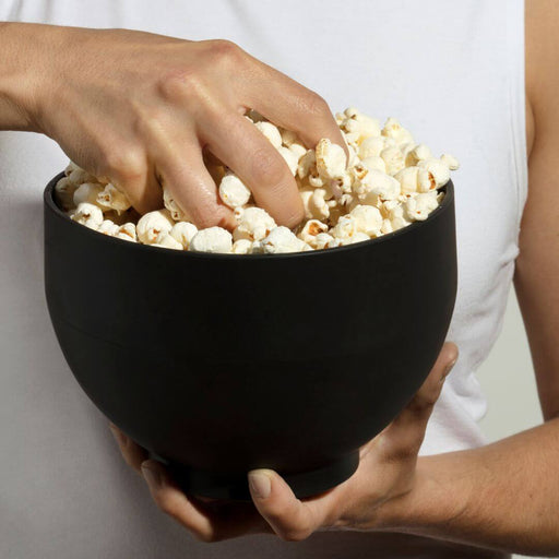 Freshly popped popcorn in Dell Cove® black silicone microwave popper, eco-friendly reusable bowl.