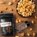 Gourmet buffalo flavored popcorn seasoning sprinkled over buttery popcorn for movie night