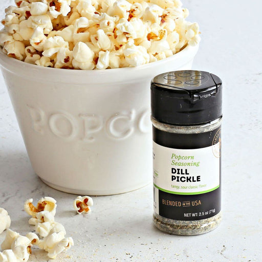 Dell Cove Dill Pickle Popcorn Seasoning jar on white background – tangy popcorn salt and flavoring made with real dill, garlic, and vinegar.