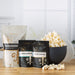 Dell Cove® Family Popcorn Gift Set with kernels, seasonings, and silicone microwave popper in ribbon-tied gift boxes.