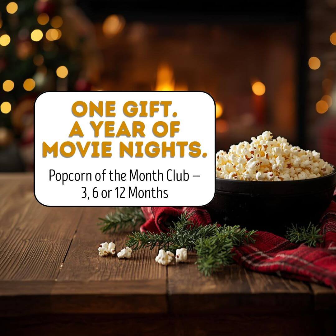 Promotional graphic for Popcorn of the Month Club with a bowl of popcorn on a wooden table, Christmas decorations, and a fireplace in the background.