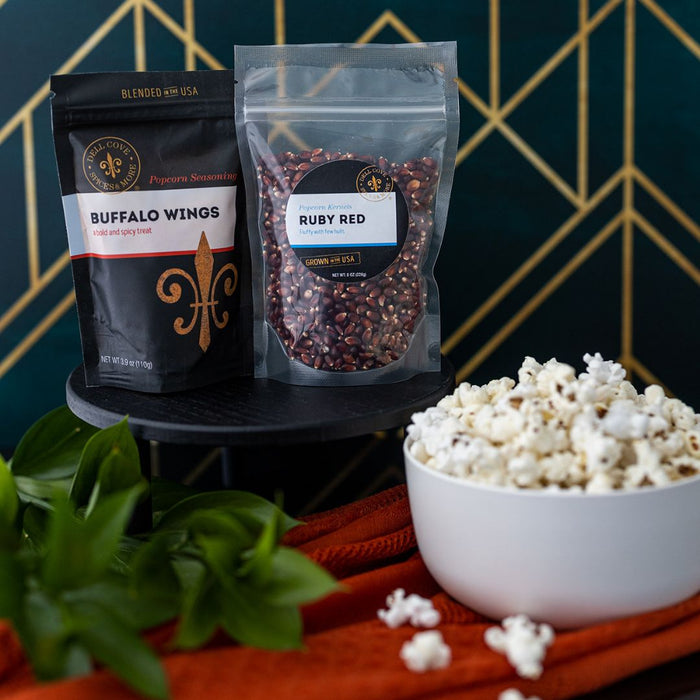Lifestyle photo of Dell Cove monthly popcorn subscription with gourmet kernels and seasoning packs, ideal popcorn club gift.