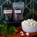 Lifestyle photo of Dell Cove monthly popcorn subscription with gourmet kernels and seasoning packs, ideal popcorn club gift.