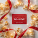 Dell Cove® virtual popcorn gift card surrounded by gourmet popcorn and festive red ribbon