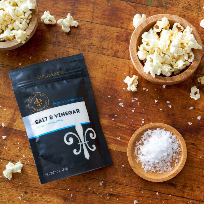 Close-up of Dell Cove Salt and Vinegar Popcorn Seasoning showing coarse sea salt and vinegar powder texture.