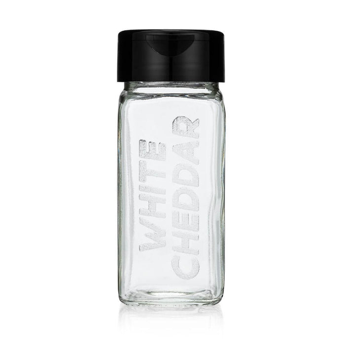 Clear glass bottle with black lid on a white background, featuring 'White Cheddar' branding.