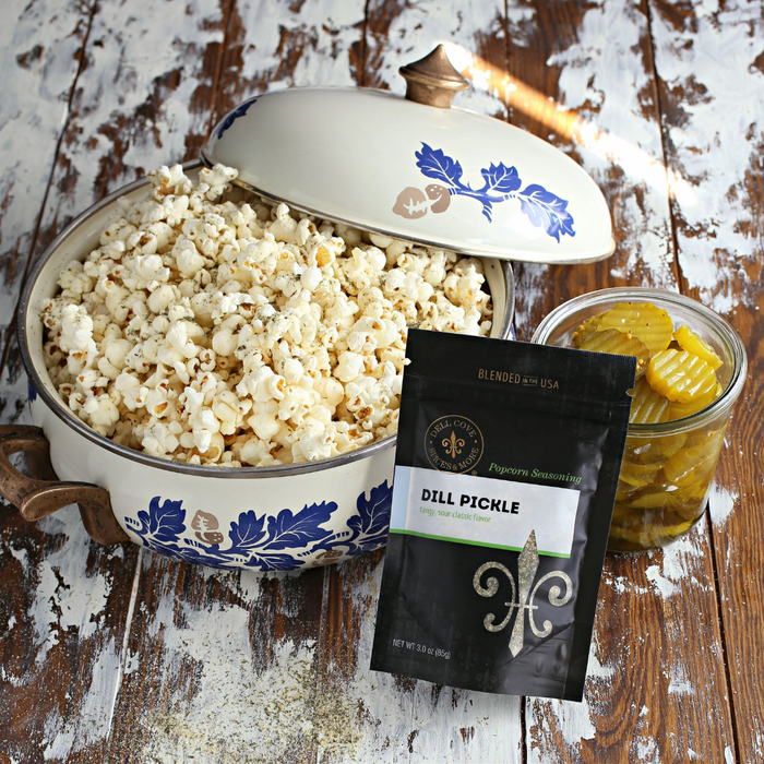 Dill Pickle popcorn seasoning - pouch with bowl of popcorn and jar of pickles - Dell Cove Spices