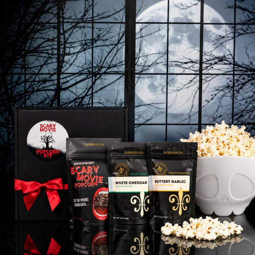 Scary Movie Vampire Halloween popcorn gift kit with Bloody Red popcorn kernels, two gourmet seasonings, black gift box with red ribbon and white skeleton-shaped microwave popcorn popper.
