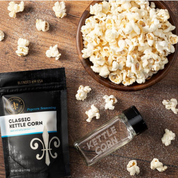 Kettle Corn popcorn seasoning pouch and bowl of popcorn with empty spice jar - dell cove spices