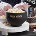 Black silicone microwave popcorn popper filled with fresh popcorn for a game day snack