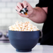 Movie Night popcorn kernels popped in a black bowl and seasonings sprinkled over the bowl - dell cove spices