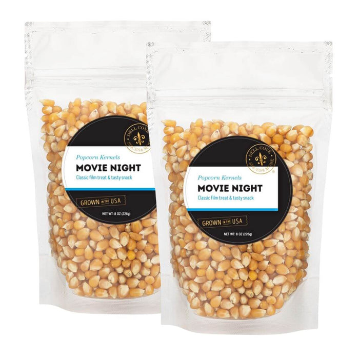Two half-pound pouches of Dell Cove Movie Night yellow butterfly popcorn kernels, sold together as the 1-pound option