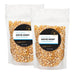 Two half-pound pouches of Dell Cove Movie Night yellow butterfly popcorn kernels, sold together as the 1-pound option