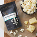 Gourmet popcorn seasoning choices such as White Cheddar are included in Dell Cove® Personalized Snack Gift Set.