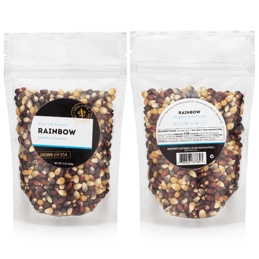 Two packages of rainbow popcorn kernels for popcorn makers with labels on a white background