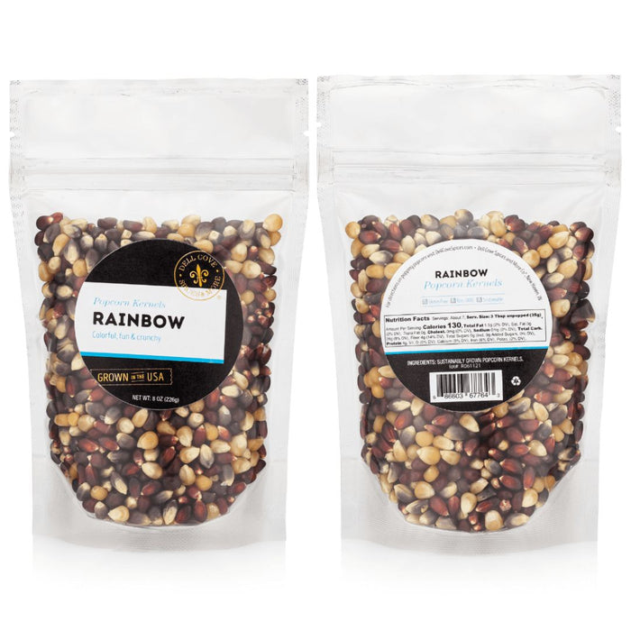 Two packages of rainbow popcorn kernels for popcorn makers with labels on a white background
