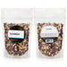 Two packages of rainbow popcorn kernels for popcorn makers with labels on a white background