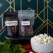 Ruby Red popcorn kernels with Buffalo Wings popcorn seasoning and popped popcorn