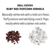 Ruby Red popcorn kernels shown beside popped red popcorn