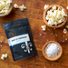 Salt and Vinegar popcorn seasoning with bowls of popcorn and sea salt- dell cove spices