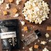 Salted Caramel popcorn seasoning pouch with bowl of popcorn and caramels and empty spice jar - dell cove spices