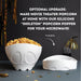 Optional white skeleton-shaped silicone microwave popcorn popper shown filled with popcorn and folded flat for storage.