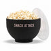 Black silicone microwave popcorn popper filled with popped popcorn with clear measuring lid