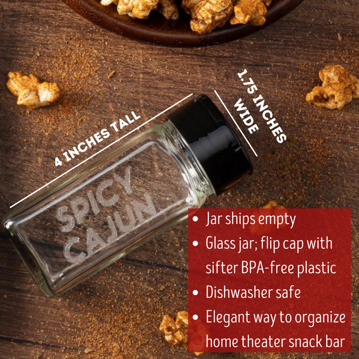 empty glass spice jar with black flip top and sifter cap with popcorn seasoning flavor SPICY CAJUN laser etched on one side with flavored popcorn  - dell cove spices
