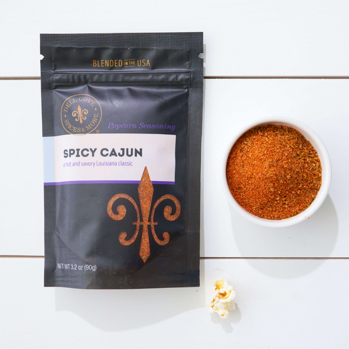 Spicy Cajun popcorn seasoning pouch with small dish of seasoning - dell cove spices