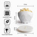 White skeleton-shaped silicone microwave popcorn popper with dimensions: 7.8 inches wide and 5.9 inches tall, with a foldable design, dishwasher-safe construction and BPA-free food-grade material.