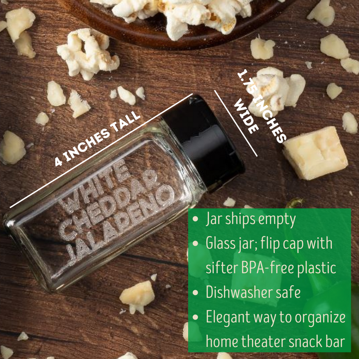 empty glass spice jar with black sifter cap laser etched with the popcorn seasoning flavor WHITE CHEDDAR JALAPENO on one side and popcorn and chunks of white cheddar cheese - dell cove spices