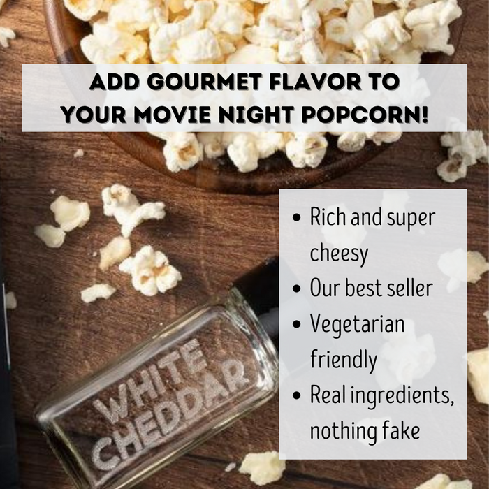 White cheddar popcorn seasoning on bowl of popcorn with empty spice jar - dell cove spices