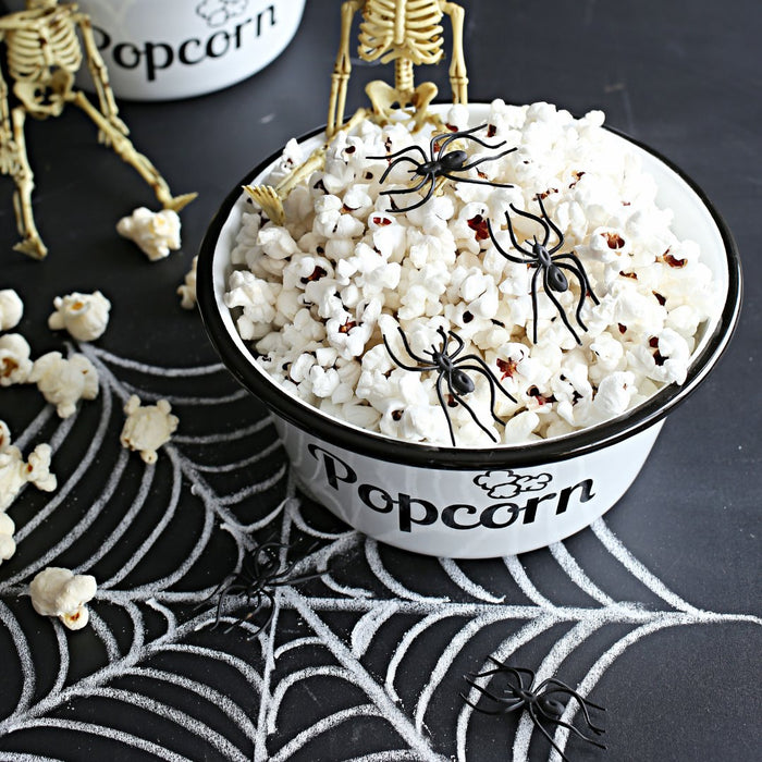 Halloween party bowl filled with Dell Cove® Zombie Movie Popcorn – spooky gourmet snack idea for scary movie night.